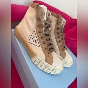 Prada 
Gabardine Triangle Logo Bi-Color Wheel High Top Sneakers